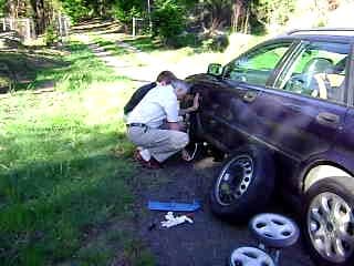 Ceri & David changing a punctured tyre on the way to The Caverns in Drakensberg, South Africa - November 2008